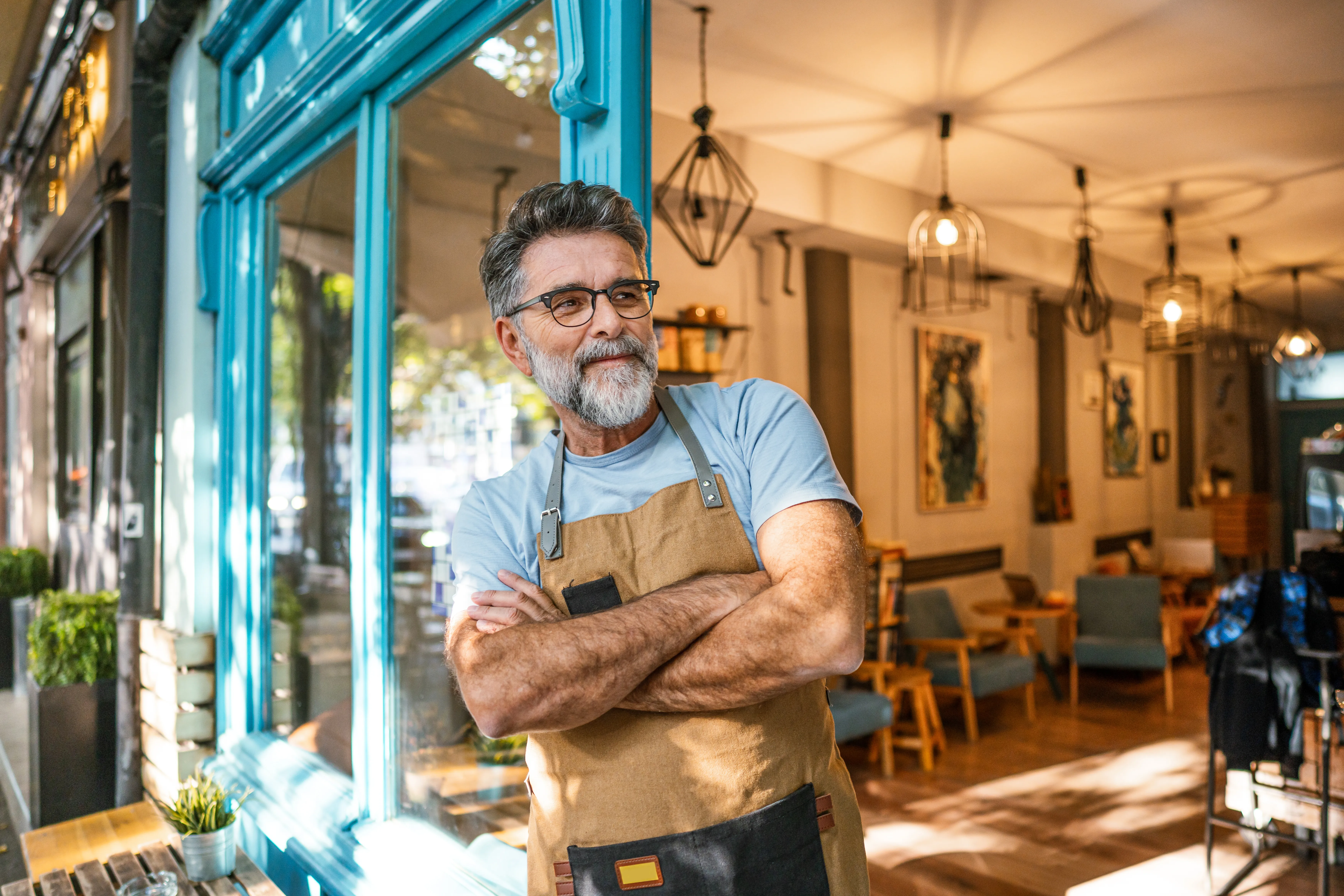 owner standing outside his coffee shop